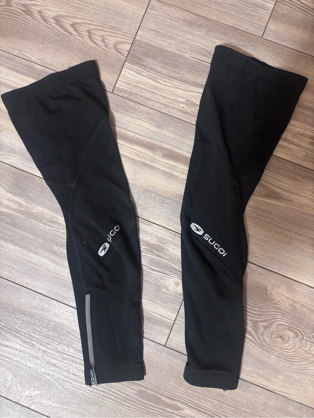 SUGOI Black Women’s Leg Warmers with Reflective Logo